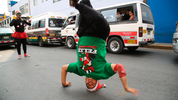 Venezuelan migrants hit Peru's street, dancing to survive