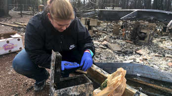 Residents head back into California town leveled by wildfire
