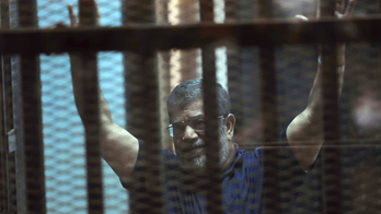 Egypt 's 2 ex-presidents appear in the same courtroom