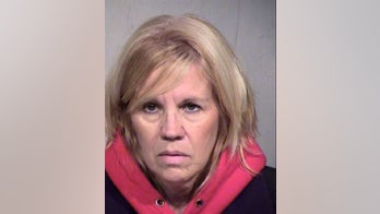 Woman suspected of posting nude photos of ex outside school his young kids attend, police say