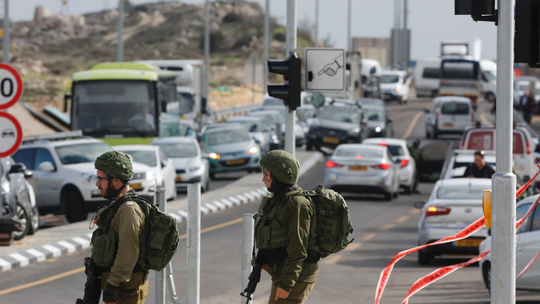 Israeli troops arrest dozens in West Bank raid