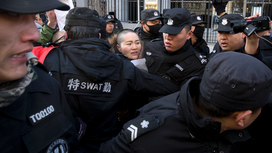 Wife of Chinese human rights lawyer protests his treatment