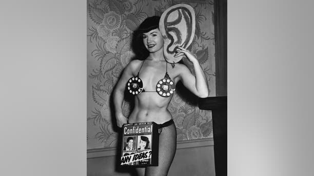 Bettie Page posing