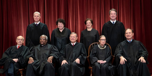 The justices of the U.S. Supreme Court gather for a formal group portrait to include the new Associate Justice, top row, far right, at the Supreme Court Building in Washington, Friday, Nov. 30, 2018. Seated from left: Associate Justice Stephen Breyer, Associate Justice Clarence Thomas, Chief Justice of the United States John G. Roberts, Associate Justice Ruth Bader Ginsburg and Associate Justice Samuel Alito Jr. Standing behind from left: Associate Justice Neil Gorsuch, Associate Justice Sonia Sotomayor, Associate Justice Elena Kagan and Associate Justice Brett M. Kavanaugh. (AP Photo/J. Scott Applewhite)