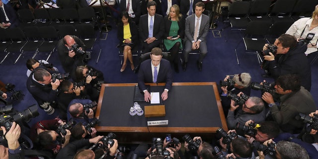 Facebook CEO Mark Zuckerberg takes his chair to attest before a corner conference of a Commerce and Judiciary Committees on Capitol Hill in Washington, Tuesday, Apr 10, 2018, about a use of Facebook information to aim American electorate in a 2016 election. (AP Photo/Pablo Martinez Monsivais)