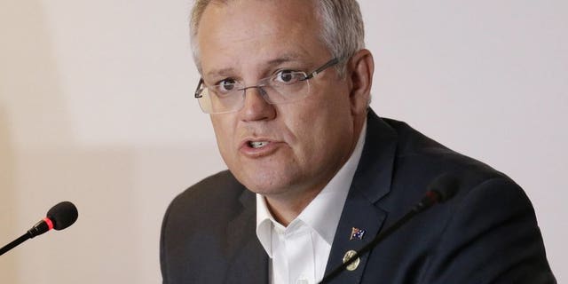 In this Nov. 18, 2018, file photo, Australian Prime Minister Scott Morrison speaks during the APEC 2018 meetings in Port Moresby, Papua New Guinea. Australia has decided to formally recognize west Jerusalem as Israel’s capital, but won’t move its embassy until there’s a peace settlement between Israel and Palestinians, Prime Minister Morrison announced Saturday.