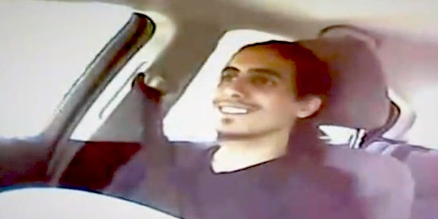This image from video shows Amer Alhaggagi riding with an undercover FBI agent.