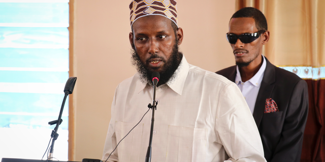 FILE - In this Wednesday, Oct. 10, 2018 file photo, Mukhtar Robow, who was once deputy leader of Africa's deadliest Islamic extremist group the al-Qaida-linked al-Shabab, speaks at a press conference about his candidacy for a regional presidency, in Baidoa, Somalia. A Somali official says Ethiopian troops that are part of the African Union forces supporting the Somali government have arrested Robow in Baidoa. (AP Photo/File)