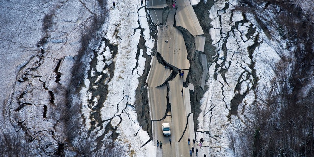 This aerial photo shows damage on Vine Road, south of Wasilla, Alaska, after earthquakes Friday, Nov. 30, 2018.