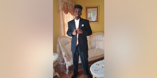   This undated image provided by Emantic Bradford, father shows Emantic Fitzgerald Bradford, son, 21, posing for a photo at his father's house near Birmingham, Alabama, in his final year of high school. 