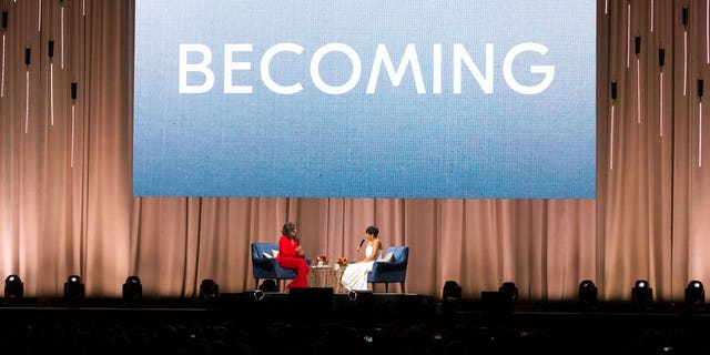   Former first lady Michelle Obama, left, is interviewed by Phoebe Robinson at one 