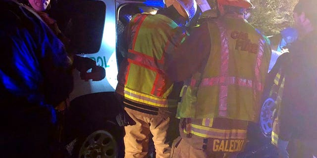 Cal Fire San Diego firefighters work at the scene of a crash along westbound Interstate 8 in Campo, Calif.