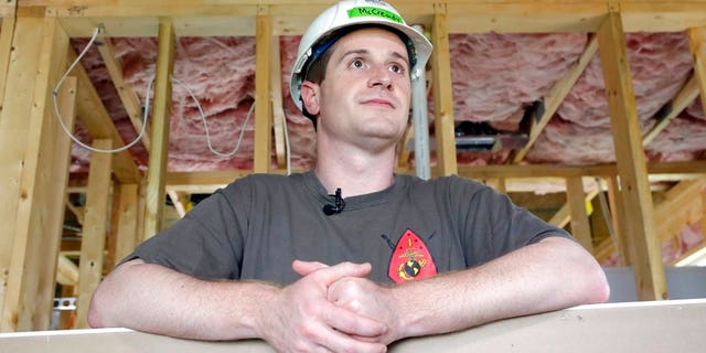 FILE - In this Sept. 26, 2018, file photo, Democratic congressional candidate Dan McCready leans against wallboard as he pauses during a Habitat For Humanity building event in Charlotte, N.C. The nation's last unresolved fall congressional race with McCready against Republican Mark Harris is awash in doubt as North Carolina election investigators concentrate on a rural county where absentee-ballot fraud allegations are so flagrant they've put the Election Day result into question. (AP Photo/Chuck Burton, File)