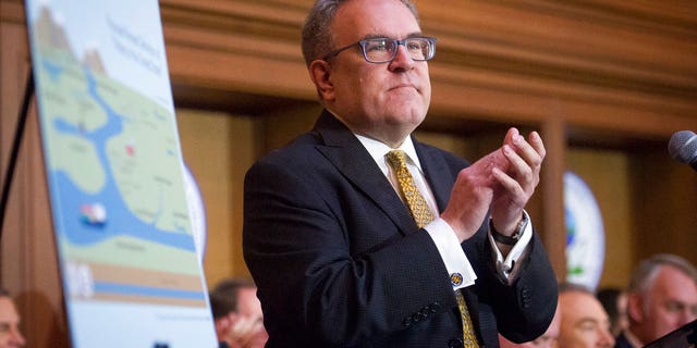 Acting Environmental Protection Agency administrator Andrew Wheeler speaking after signing an order withdrawing federal protections for countless waterways and wetlands at EPA headquarters in Washington on Tuesday. (AP Photo/Cliff Owen)