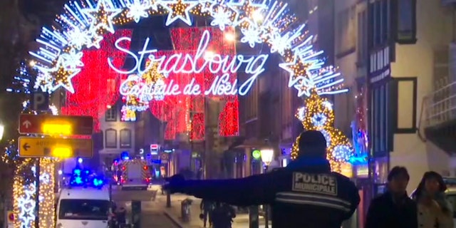 In this image made from video, emergency services arrive on the scene of a Christmas market in Strasbourg, France, on Tuesday.