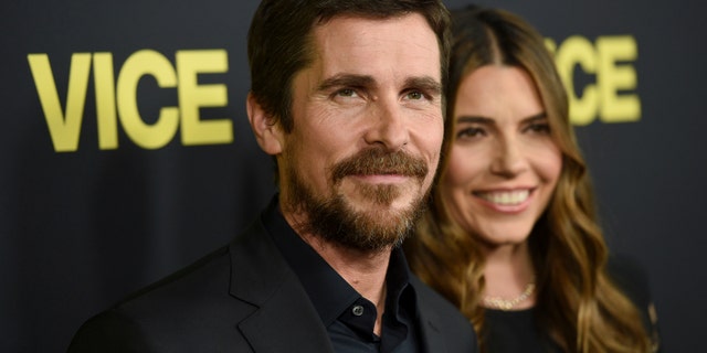 Christian Bale, left, and Sibi Blazic arrive at the world premiere of "Vice" on Tuesday, Dec. 11, 2018, at the Samuel Goldwyn Theater in Beverly Hills, Calif.