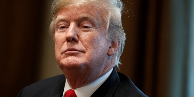 FILE -- President Donald Trump listens during a meeting in the Cabinet Room of the White House in Washington. (AP Photo/Evan Vucci, File)