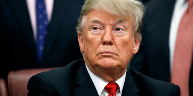 President Trump during a signing ceremony for criminal justice reform legislation in the Oval Office on Friday. (Associated Press)