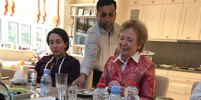 Sheikha Latifa bint Mohammed Al Maktoum, a daughter of Dubai's ruler Sheikh Mohammed bin Rashid Al Maktoum, left, eats a meal with Mary Robinson, a former United Nations High Commissioner for Human Rights and former president of Ireland, right, in Dubai, United Arab Emirates. (United Arab Emirates Ministry of Foreign Affairs and International Cooperation via AP)