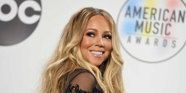 FILE - In this Oct. 9, 2018 file photo, Mariah Carey poses in the press room at the American Music Awards at the Microsoft Theater in Los Angeles. Carey’s 24-year-old Christmas classic is so popular it set a new one-day streaming record on Spotify on Christmas Eve. Chart Data reported that “All I Want for Christmas Is You,” released in 1994, was played 10.8 million times on Spotify on Monday, Dec. 24, 2018.