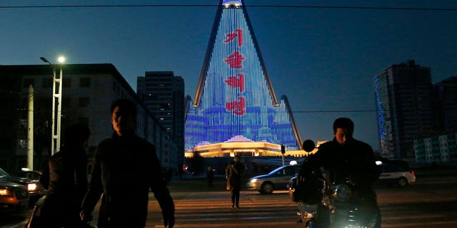 For several hours each night, the building that doesn't have electricity inside becomes the backdrop of a massive light show in which more than 100,000 LEDs flash images of famous statues and monuments, bursts of fireworks, party symbols, and political slogans.