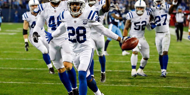 Indianapolis Colts cornerback Chris Milton (28) celebrates after recovering a punt fumbled by the Tennessee Titans in the first half of an NFL football game in Nashville, Tenn.