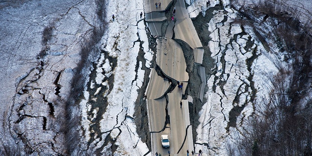 Aerial photo shows damage on Vine Road, south of Wasilla, Alaska, after earthquake Friday. (Marc Lester/Anchorage Daily News via AP)