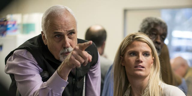 Alaska House District 1 candidate Republican Bart LeBon points to a vote tally board with his campaign manager Brittany Hartmann during a election recount at the Department of Elections' Juneau office on Friday, Nov. 30, 2018. 