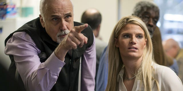 Alaska House District 1 candidate Republican Bart LeBon points to a vote tally board with his campaign manager Brittany Hartmann during a election recount at the Department of Elections' Juneau office on Friday, Nov. 30, 2018.