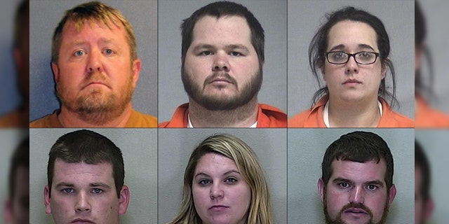 The nine suspects, six of which are seen here, were charged in connection with the bear maulings.