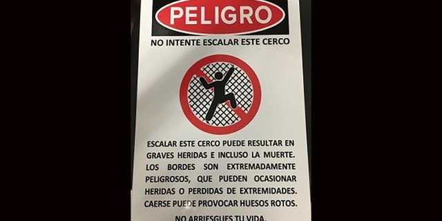 Signs are located in multiple locations along the wall where the pair fell, warning about the dangers of scaling the structure.