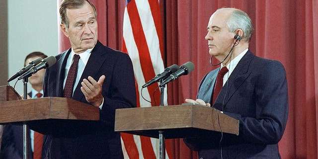 FILE - In this Oct. 29, 1991, file photo, President George H.W. Bush gestures during a joint news conference with Soviet President Mikhail Gorbachev, at the Soviet Embassy in Madrid. Bush died at the age of 94 on Friday, Nov. 30, 2018, about eight months after the death of his wife, Barbara Bush. (AP Photo/Jerome Delay, File)