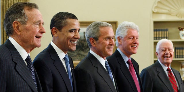 FILE - In this Jan. 7, 2009, file photo, President George W. Bush, center, poses with President-elect Barack Obama, second left, and former presidents, George H.W. Bush, left, Bill Clinton, second right, and Jimmy Carter, right, in the Oval Office of the White House in Washington. Bush has died at age 94. Family spokesman Jim McGrath says Bush died shortly after 10 p.m. Friday, Nov. 30, 2018, about eight months after the death of his wife, Barbara Bush. (AP Photo/J. Scott Applewhite, File)