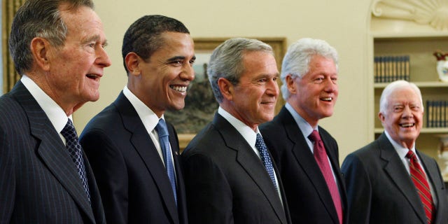 FILE - In this Jan. 7, 2009, file photo, President George W. Bush, center, poses with President-elect Barack Obama, second left, and former presidents, George H.W. Bush, left, Bill Clinton, second right, and Jimmy Carter, right, in the Oval Office of the White House in Washington. Bush has died at age 94. Family spokesman Jim McGrath says Bush died shortly after 10 p.m. Friday, Nov. 30, 2018, about eight months after the death of his wife, Barbara Bush. (AP Photo/J. Scott Applewhite, File)