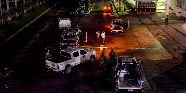 Policemen work at a crime scene after a colleague was killed in Acapulco on July 23, 2018. (FRANCISCO ROBLES/AFP/Getty Images)