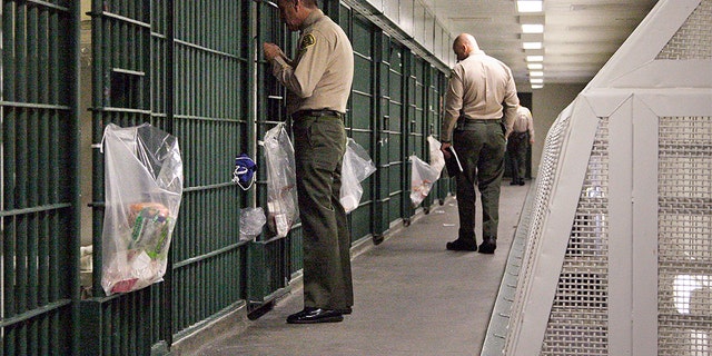 Los Angeles County deputies inspecting a cell block at the Men's Central Jail in downtown Los Angeles in 2012.
