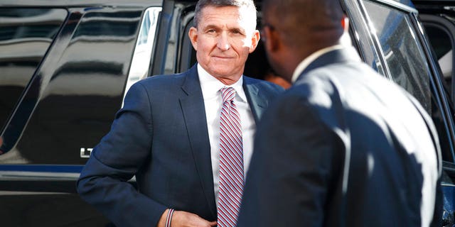 Michael Flynn arrives at federal court in Washington, Tuesday, Dec. 18, 2018. (AP Photo/Carolyn Kaster)