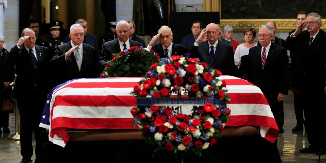 Former Secretary of State Colin Powell, third from left, leads former Operation Desert Storm commanders as they pay their last respects to former President George H.W. Bush as he lies in state at the U.S. Capitol in Washington, Tuesday. (Associated Press)