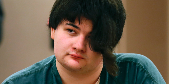 Andrew Balcer listens to testimony during the sentencing hearing for killing his parents, Dec. 4, 2018, at the Capital Judicial Center in Augusta, Maine.