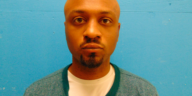 This Dec 30, 2018 booking photo released by Guadalupe County Sheriff's Office shows Tony Dwayne Albert II. A waitress in a suburban San Antonio restaurant says 33-year-old Albert asked for the nearest Baptist church and as he left, she saw him gripping a weapon. She says an employee locked the door after he left and her mother called police, who arrested Albert after finding him with a loaded handgun, extra ammunition and a face shield. (Guadalupe County Sheriff's Office via AP)