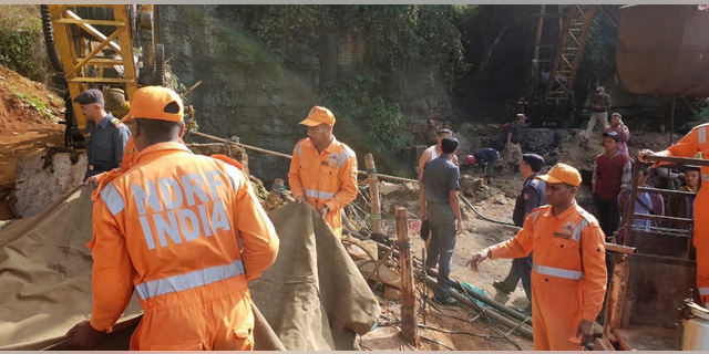 Rescuers work at the site of a coal mine that collapsed in Ksan, in the northeastern Indian state of Meghalaya, Friday, Dec. 14, 2018. Thirteen young miners were missing and feared dead following the collapse of a shaft and flooding of a coal mine they were digging illegally in India's remote northeast, police said Friday. (AP Photo/Sannio Siangshai)