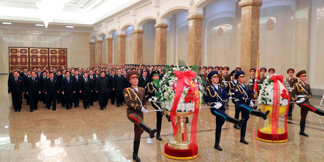In this photo provided by the North Korean government, North Korean leader Kim Jong Un, sixth from left, visits the Kumsusan Palace of the Sun, where the body of late leader Kim Jong Il is laid, in Pyongyang, North Korea, Monday, Dec. 17, 2018. North Koreans are marking the seventh anniversary of the death of leader Kim Jong Il with visits to statues and vows of loyalty to his son and successor, Kim Jong Un. Independent journalists were not given access to cover the event depicted in this image distributed by the North Korean government. The content of this image is as provided and cannot be independently verified. Korean language watermark on image as provided by source reads: "KCNA" which is the abbreviation for Korean Central News Agency. (Korean Central News Agency/Korea News Service via AP)