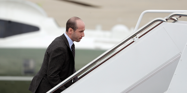 FILE - In this Nov. 2, 2018, file photo, President Donald Trump's White House Senior Adviser Stephen Miller boards Air Force One for campaign rallies in West Virginia and Indiana, in Andrews Air Force Base, Md. The White House is digging in on its demand for $5 billion to build a border wall as congressional Democrats stand firm against it, pushing the federal government closer to the brink of a partial shutdown. Miller says Trump is prepared to do “whatever is necessary” to build a wall along the U.S.-Mexico border. (AP Photo/Evan Vucci, File)