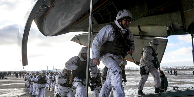 Soldiers of the Ukrainian air assault units board a military cargo aircraft at a military base in the Zhytomyr region, Ukraine, Thursday, Dec. 6, 2018. The long-simmering conflict between Russia and Ukraine that started with Russia's annexation of Crimea spilled into the open on Nov. 25 when the Russian coast guard fired upon and seized three Ukrainian naval vessels and their crews, to which Ukrainian President Petro Poroshenko responded by introducing a martial law for 30 days and Ukraine has beefed up its forces on the border with Russia. (Mikhail Palinchak, Presidential Press Service via AP)