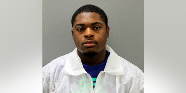 This photo provided by the Chicago Police Department shows Edward Brown, 24. Brown is facing two felony weapons charges in connection with the deaths of two Chicago police officers who were struck and killed by a commuter train while they were chasing him. Chicago police said Wednesday, Dec. 19, 2018, that  Brown is charged with reckless discharge of a firearm-endangerment and aggravated unlawful use of a weapon-loaded. He's due in bond court Thursday.  (Chicago Police Department via AP)