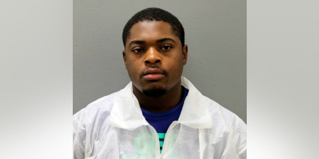 This photo provided by the Chicago Police Department shows Edward Brown, 24. Brown is facing two felony weapons charges in connection with the deaths of two Chicago police officers who were struck and killed by a commuter train while they were chasing him. Chicago police said Wednesday, Dec. 19, 2018, that Brown is charged with reckless discharge of a firearm-endangerment and aggravated unlawful use of a weapon-loaded. He's due in bond court Thursday. (Chicago Police Department via AP)