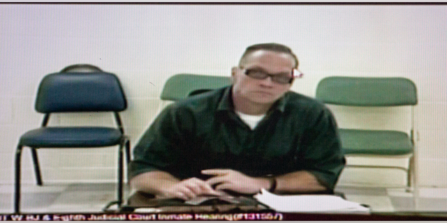 In this Dec. 5, 2017, file photo, Nevada death row inmate Scott Dozier appears for his court hearing via video at the Regional Justice Center in Las Vegas. (Erik Verduzco/Las Vegas Review-Journal via AP)