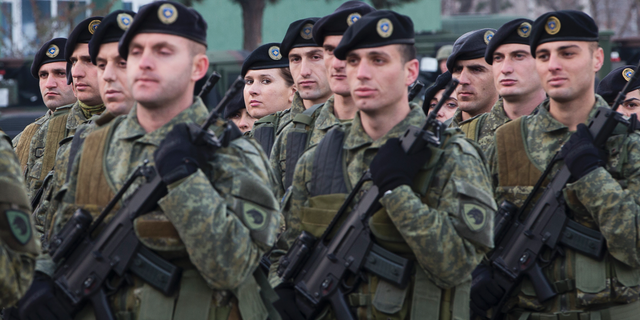Members of Kosovo Security Force line up for inspection by Kosovo president Hashim Thaci in capital Pristina, Kosovo, on Thursday, Dec. 13, 2018. Kosovo lawmakers are set to transform the Kosovo Security Force into a regular army. (AP Photo/Visar Kryeziu)