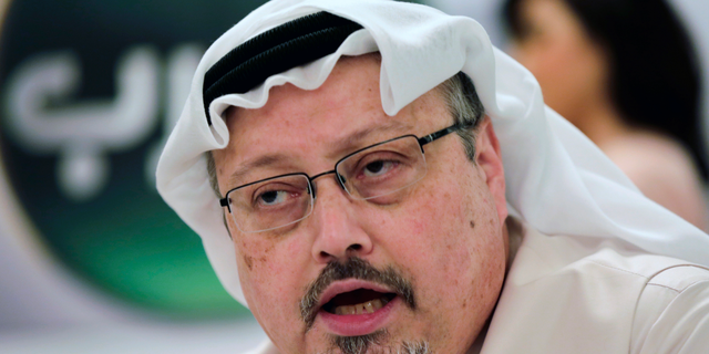 FILE - In this Dec. 15, 2014, file photo, Saudi journalist Jamal Khashoggi speaks during a press conference in Manama, Bahrain. A New York-based organization dedicated to the safety of journalists says the number killed worldwide in reprisal for their work, including Khashoggi, nearly doubled in 2018. Khashoggi was one of 53 journalists killed between Jan. 1 and Dec. 14, 2018, the committee said. (AP Photo/Hasan Jamali, File)