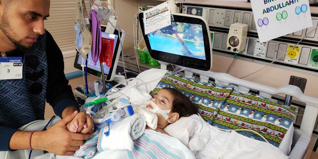 FILE - This recent undated photo, released Monday, Dec. 17, 2018, by the Council on American-Islamic Relations in Sacramento, Calif., shows Ali Hassan with his dying 2-year-old son Abdullah in a Sacramento hospital. Abdullah Hassan, the son of a Yemeni woman who sued the Trump administration to let her into the country to be with the ailing boy has died. The Council on American-Islamic Relations announced Friday, Dec. 28 that Abdullah died in an Oakland, Calif., hospital. He suffered from a genetic brain condition. (Council on American-Islamic Relations via AP, File)